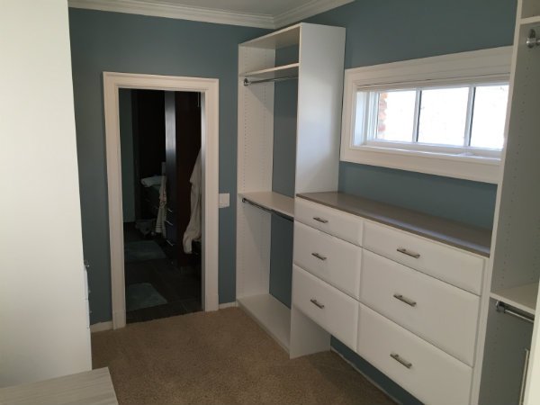 Concrete and White Walk-In Closet